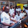 Teenage mothers interact with MTN’s donated computers at the Inebantu Lady Alice Mulooki Memorial Library and ICT Centre