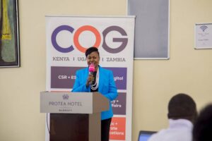 The President of Uganda Marketers Society (UMS)- Charity Winnie Kamusiime Asiimwe during her speech at the ESG summit.