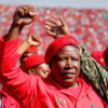 PRETORIA, SOUTH AFRICA - MAY 04: Commander and chief of the Economic Freedom Fighters and South African presidential candidate Julius Malema greets supporters as he enters the Lucas Moripe Stadium for an Economic Freedom Fighters presidential campaign rally at the Lucas Moripe Stadium on May 4, 2014 in Pretoria, South Africa. The rally comes prior to the South African presidential elections which are scheduled to be held on May 7, 2014. (J. Countess/Getty Images)